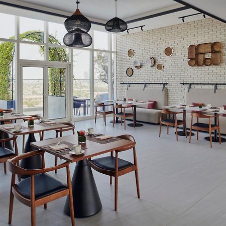 Movenpick Jumeirah Village Triangle 두바이 외부 사진 Restaurant