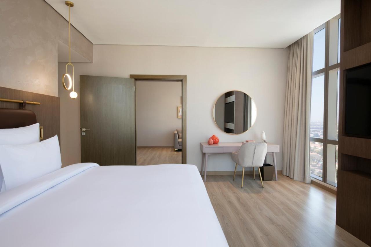 Movenpick Jumeirah Village Triangle 두바이 외부 사진 A bedroom at the hotel