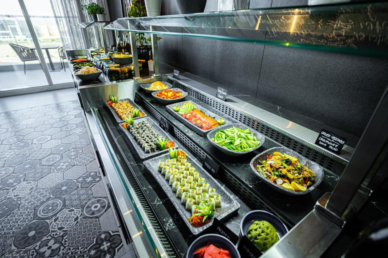 Movenpick Jumeirah Village Triangle 두바이 외부 사진 A salad bar