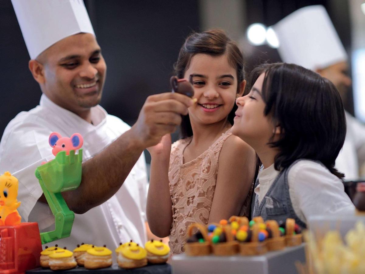 Movenpick Jumeirah Village Triangle 두바이 외부 사진 A pastry chef at work